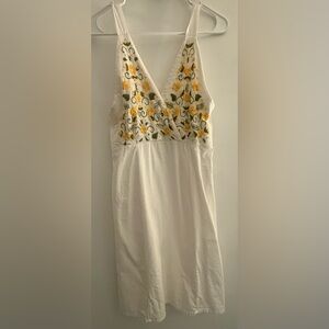 Elegant White Dress with Yellow Floral Accents